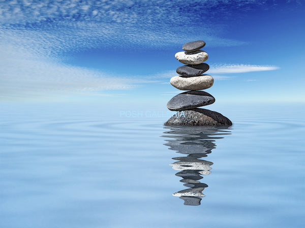 STONES RISING FROM WATER TO BLUE SKY