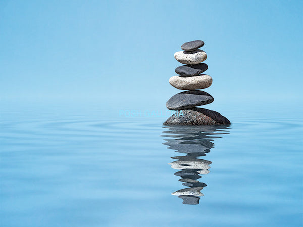 STONES RISING FROM CALM BLUE WATER
