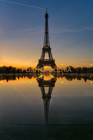 PARIS EIFFEL TOWER ON REFLECTION OF WATER AT SUNSET